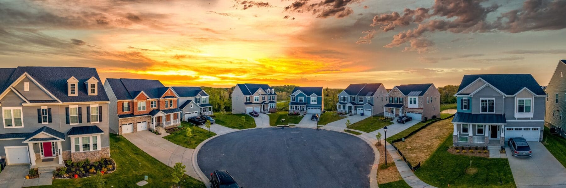 Cul de sac classic street with sunset in the back ground showing beautiful homes home refinance